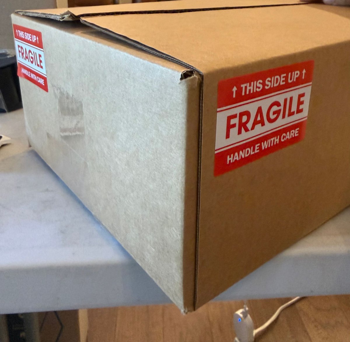 Fragile stickers on both long sides of a box